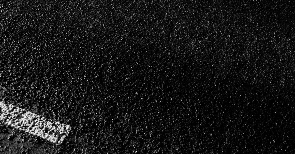 intermittent solid crust on top of yogurt - Textured backdrop of rough road with marking lines intermittent solid crust on top of yogurt - Textured backdrop of rough road with marking lines