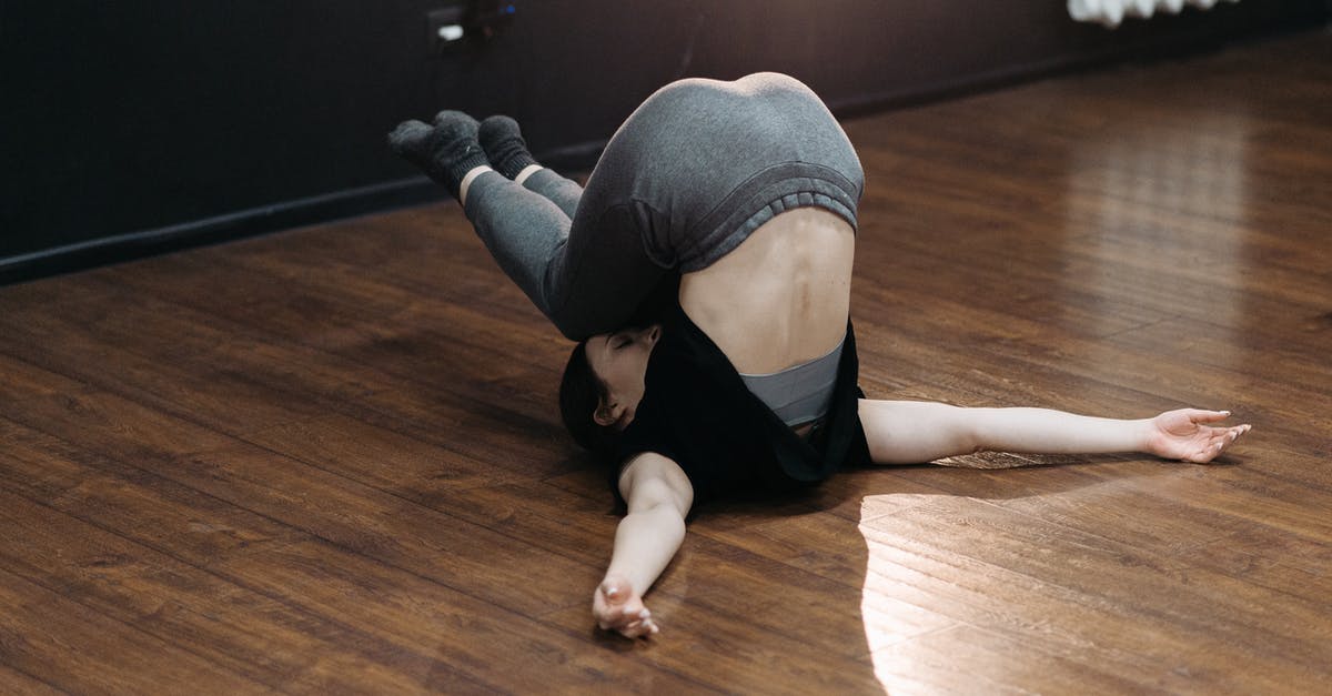 Inversion Canning - A Woman in Upside Down Position on the Floor Inversion Canning - A Woman in Upside Down Position on the Floor