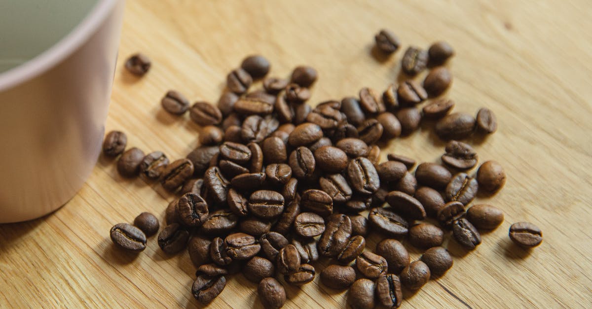 Is 1 cup of rice powder equal to 1 cup of uncooked rice? [closed] - Coffee beans near empty pink cup
