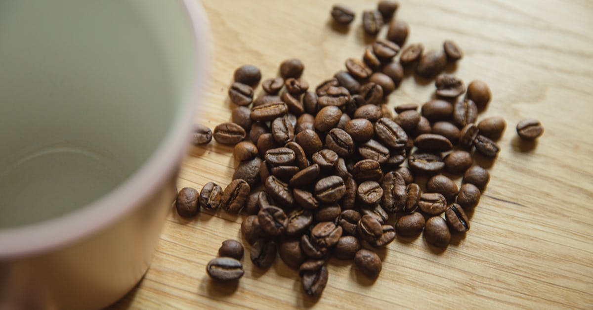 Is 1 cup of rice powder equal to 1 cup of uncooked rice? [closed] - Coffee beans placed near big cup