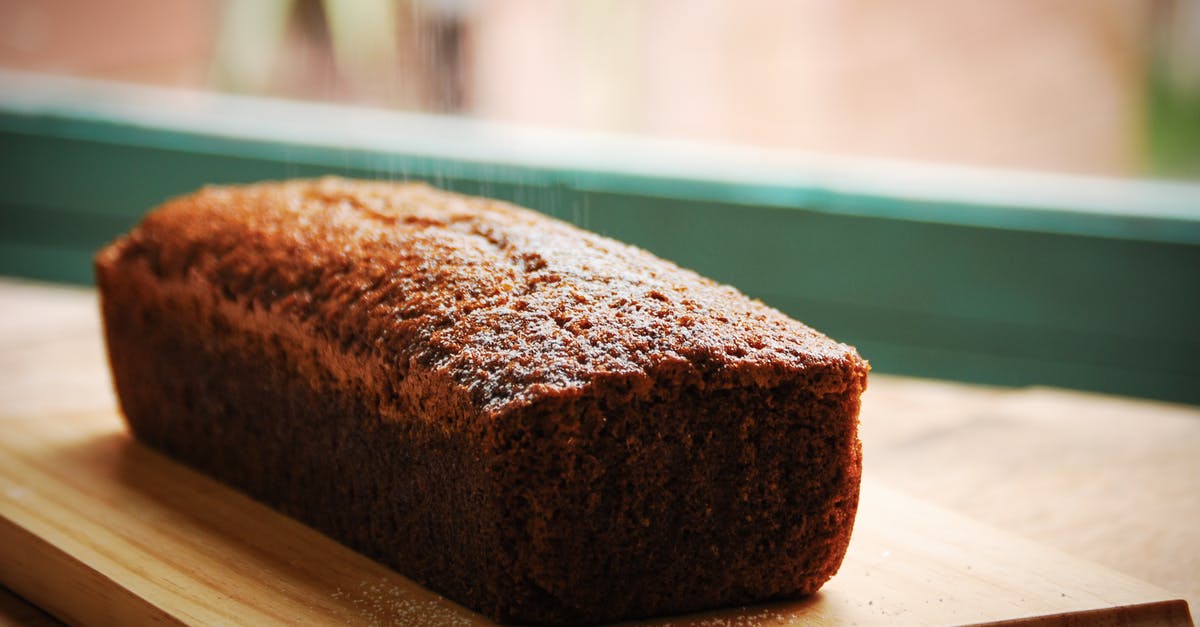 Is a partially translucent banana safe to cook with? - Closeup of sweet delicious fresh baked banana bread cake placed on wooden cutting board in kitchen