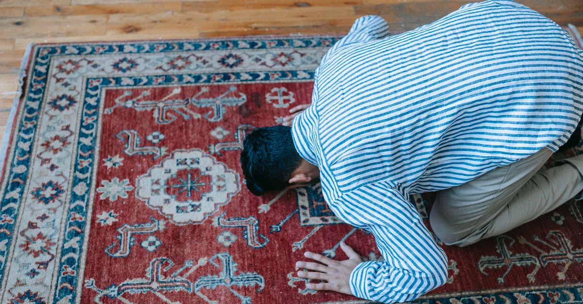 Is allspice traditional in the Levant? - Man in Blue and White Stripe Dress Shirt Bowing Down on Red and Blue Area Rug Is allspice traditional in the Levant? - Man in Blue and White Stripe Dress Shirt Bowing Down on Red and Blue Area Rug