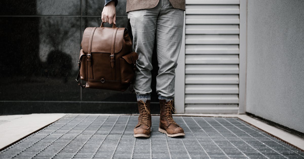 Is beef 'aged' in vacuum packed bags? - Photo of Man in Brown Blazer,Gray Pants, and Brown Boots Holding Brown Leather Bag Standing Outside Building Is beef 'aged' in vacuum packed bags? - Photo of Man in Brown Blazer,Gray Pants, and Brown Boots Holding Brown Leather Bag Standing Outside Building