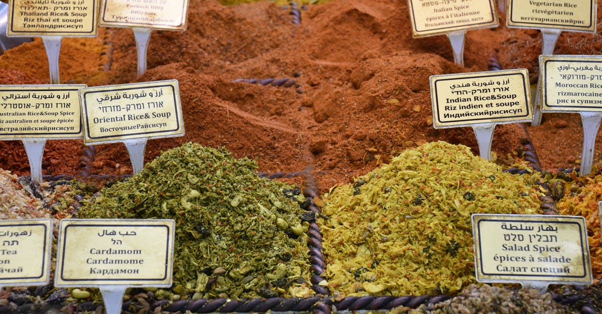 Is Calrose rice a decent choice for paella? - From above of collection of colorful aromatic dry condiments with titles in street market Is Calrose rice a decent choice for paella? - From above of collection of colorful aromatic dry condiments with titles in street market
