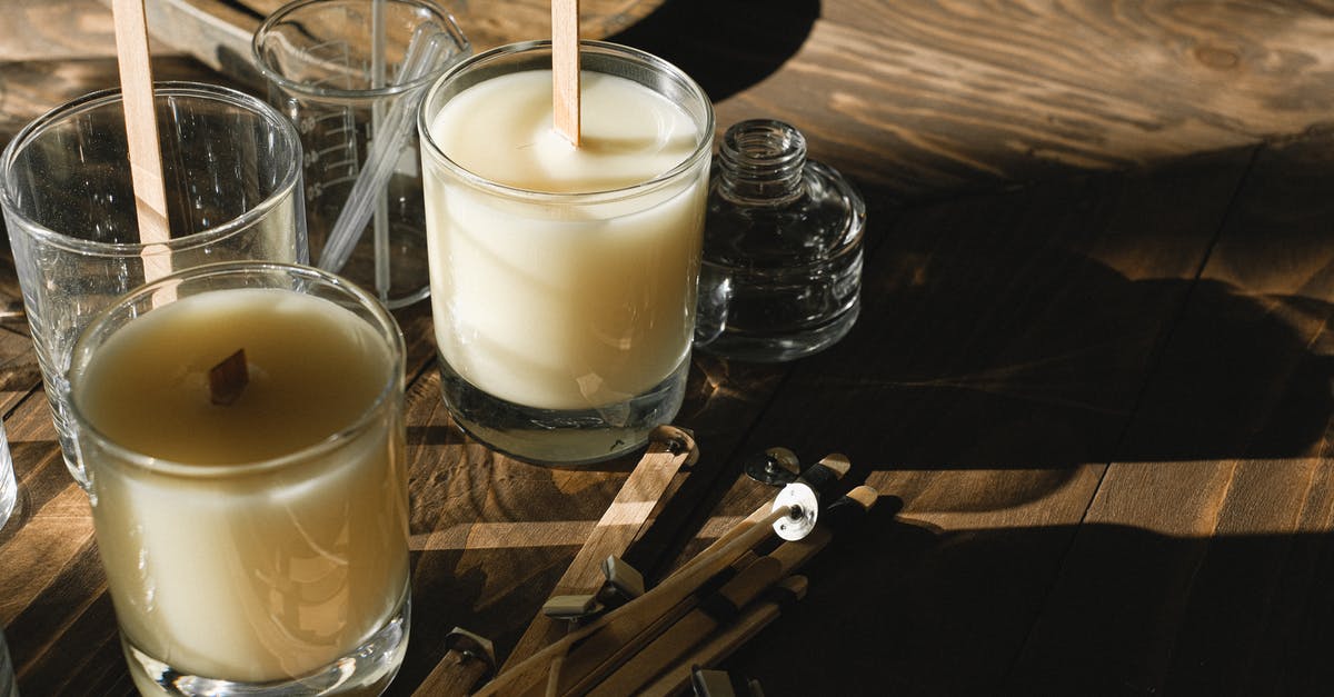 Is candle wax and cheese wax the same thing? - Glasses with organic candles on wooden table Is candle wax and cheese wax the same thing? - Glasses with organic candles on wooden table