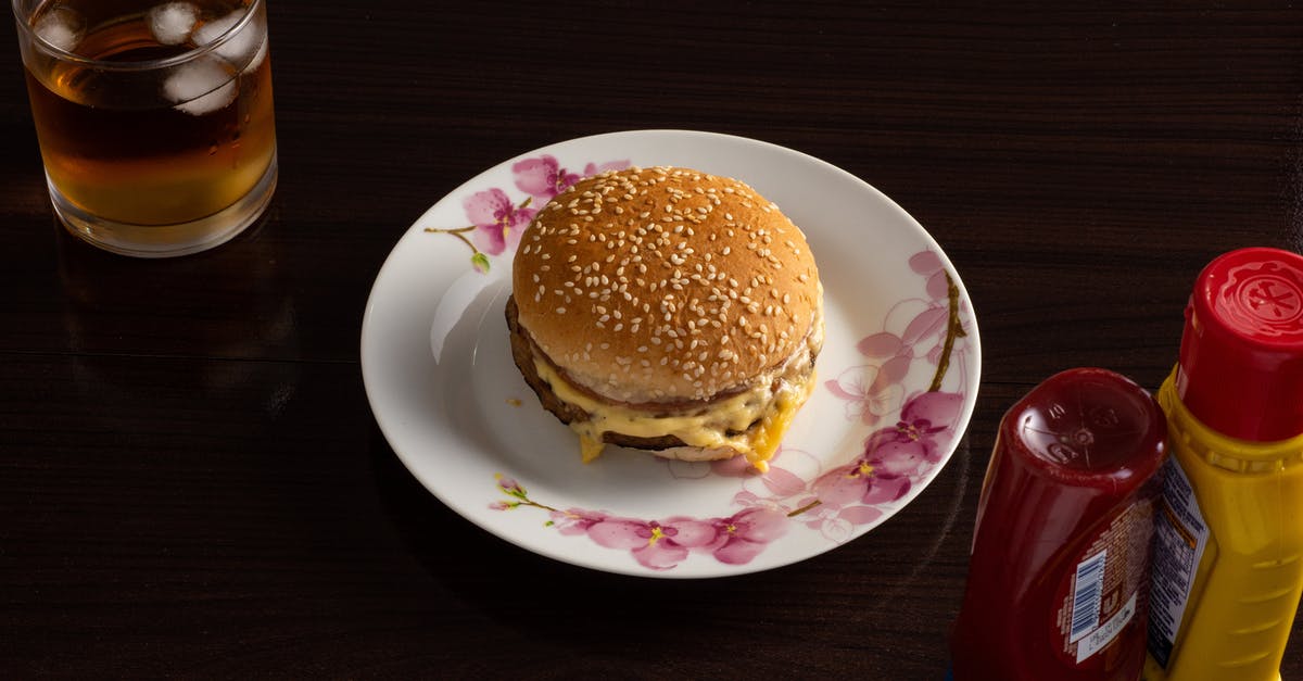 Is cheese a condiment? (Burgers, sandwiches, etc) - Hamburger on White and Pink Floral Plate Is cheese a condiment? (Burgers, sandwiches, etc) - Hamburger on White and Pink Floral Plate