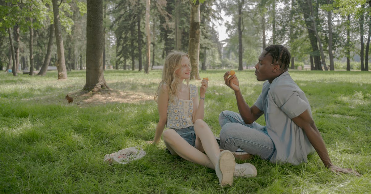 Is eating rice well after its use-by date a bad idea? [duplicate] - Man And Woman Sitting on the Grass and Eating Peaches