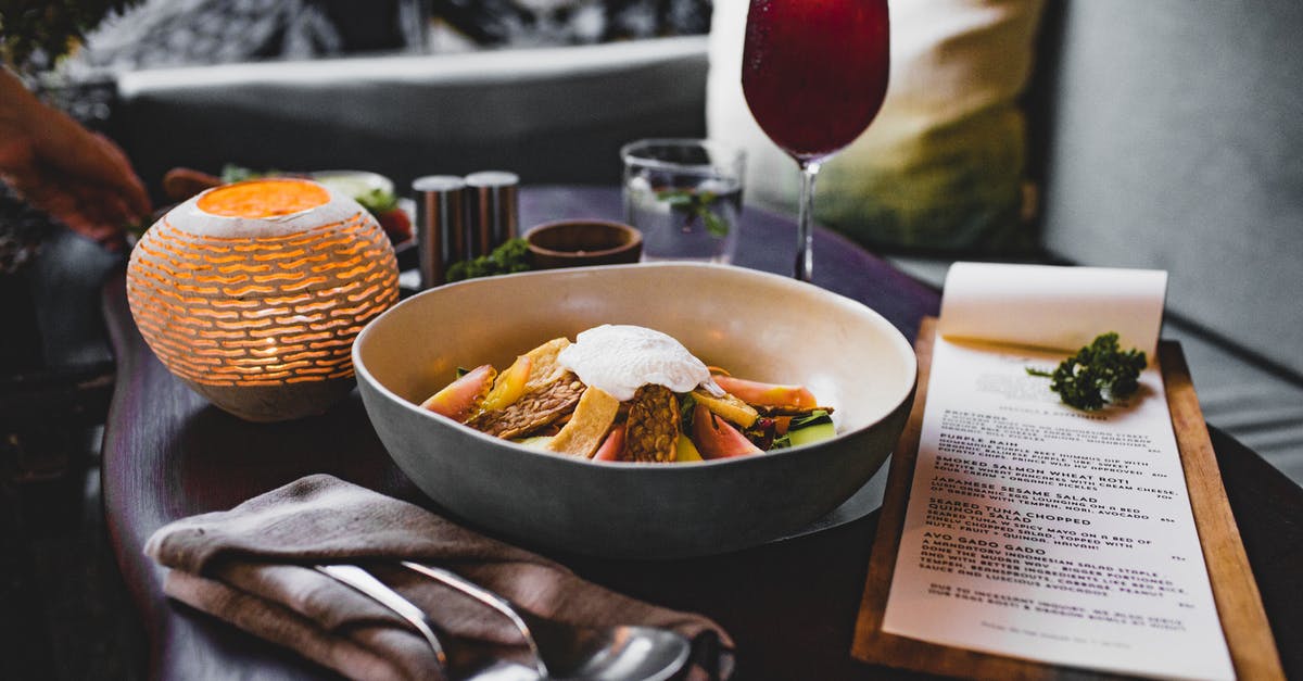 Is Glass and Ceramic cookware suitable for high-heat frying and stir-frying? - From above of bowl with tasty salad with nut bars and fried egg white on top near glass of red wine and candle on wooden table close to cozy sofa Is Glass and Ceramic cookware suitable for high-heat frying and stir-frying? - From above of bowl with tasty salad with nut bars and fried egg white on top near glass of red wine and candle on wooden table close to cozy sofa