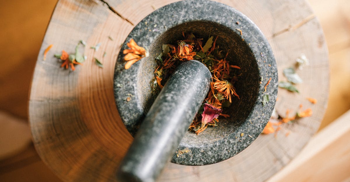Is it a good idea to grind dried oregano with a mortar and pestle? - Black Mortar and Pestle over a Wood Is it a good idea to grind dried oregano with a mortar and pestle? - Black Mortar and Pestle over a Wood