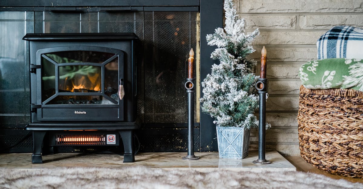 Is it normal that I keep burning my seasoning off my cast iron? - A Cast Iron Fireplace Beside Christmas Tree and Basket of Blankets Is it normal that I keep burning my seasoning off my cast iron? - A Cast Iron Fireplace Beside Christmas Tree and Basket of Blankets