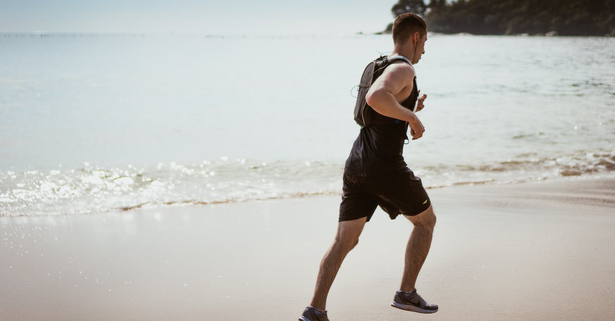 Is it OK to defrost chicken by running water over it? - Man Wearing Black Tank Top and Running on Seashore Is it OK to defrost chicken by running water over it? - Man Wearing Black Tank Top and Running on Seashore