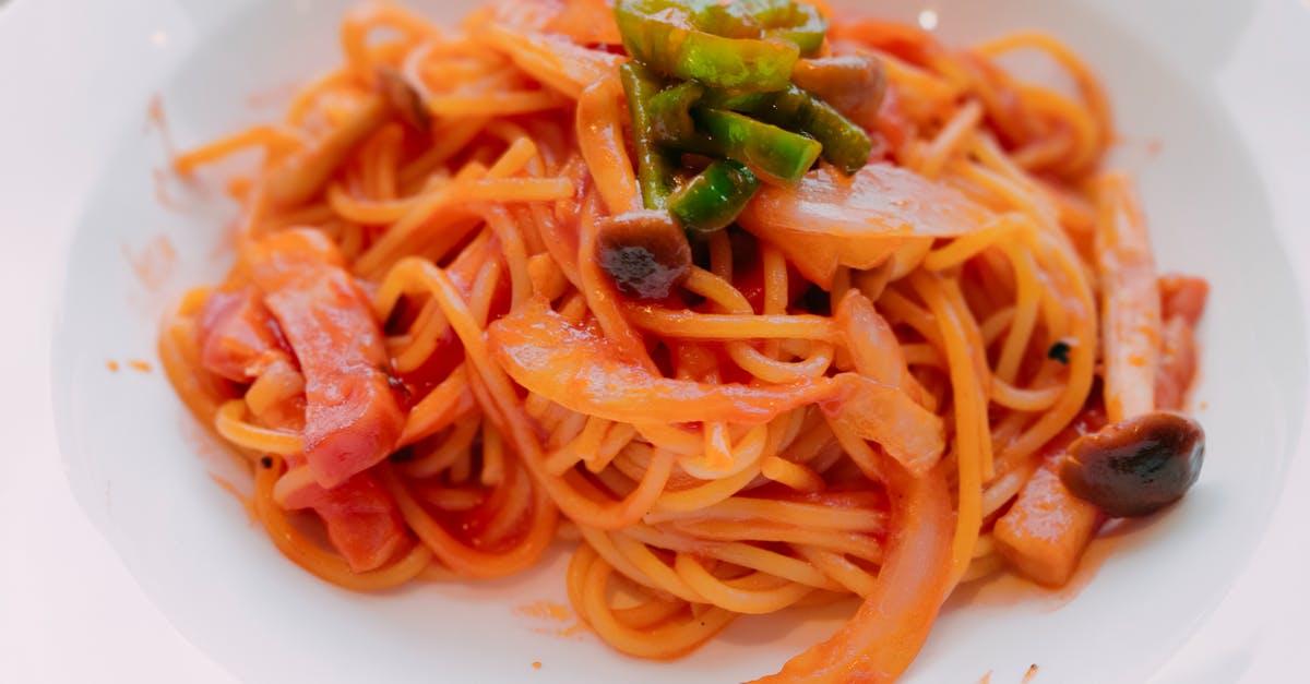 Is it OK to reheat my spaghetti sauce over & over? - Spaghetti With Green Leaf on White Ceramic Plate Is it OK to reheat my spaghetti sauce over & over? - Spaghetti With Green Leaf on White Ceramic Plate