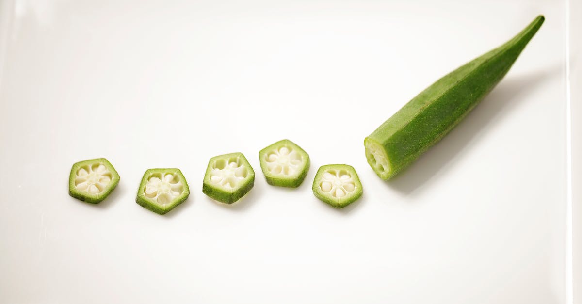 Is it ok to use frozen okra in gumbo? - Chopped natural okra on ceramic plate