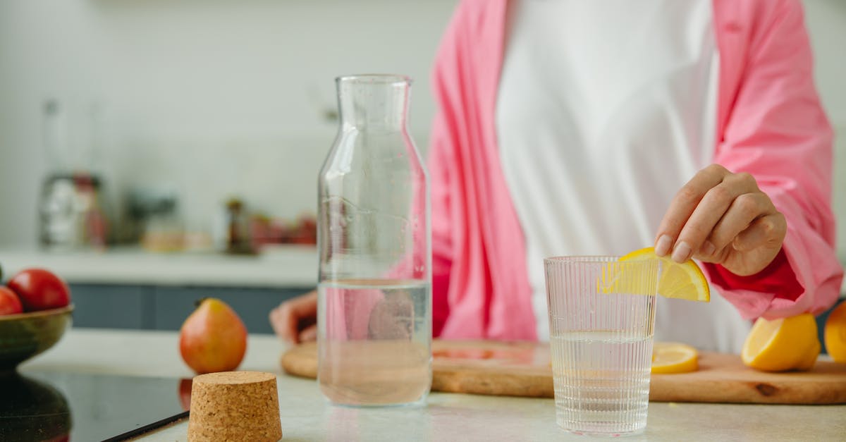Is it okay for cork to look a bit "moldy"? - Woman in White Long Sleeve Shirt Holding Clear Glass Pitcher Is it okay for cork to look a bit "moldy"? - Woman in White Long Sleeve Shirt Holding Clear Glass Pitcher