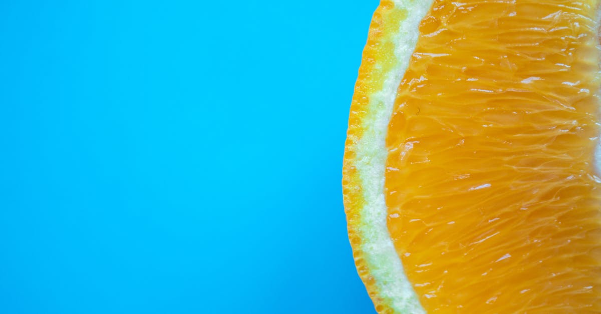 Is it possible to be able to withstand intense flavors while preserving sensibility to subtle ones? - Top view of bright juicy tropical fruit slice with tender orange pulp on blue surface Is it possible to be able to withstand intense flavors while preserving sensibility to subtle ones? - Top view of bright juicy tropical fruit slice with tender orange pulp on blue surface