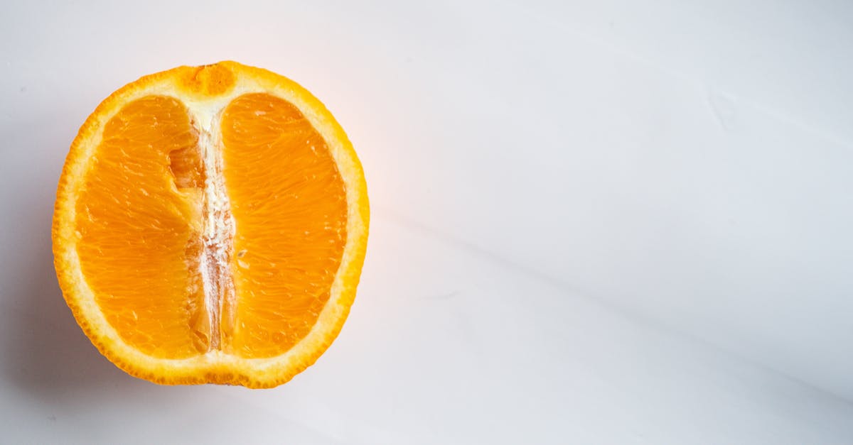 Is it possible to be able to withstand intense flavors while preserving sensibility to subtle ones? - From above of bright cut citrus fruit full of vitamin with orange peel on table Is it possible to be able to withstand intense flavors while preserving sensibility to subtle ones? - From above of bright cut citrus fruit full of vitamin with orange peel on table