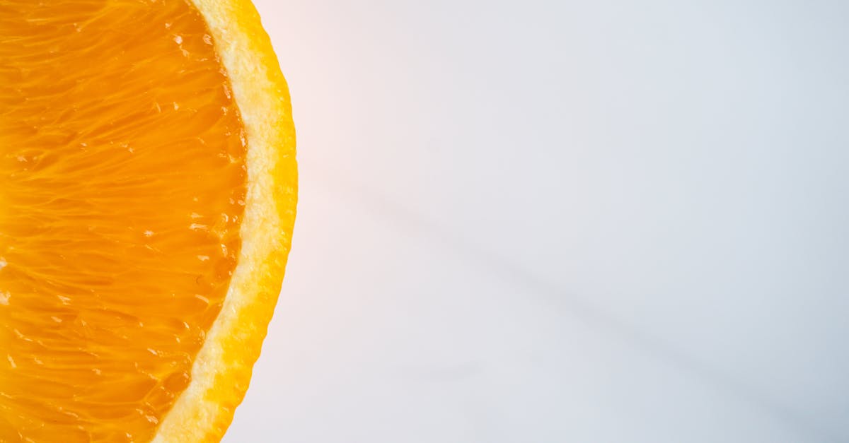 Is it possible to be able to withstand intense flavors while preserving sensibility to subtle ones? - From above of cut juicy orange with bright tender pulp and thick peel on table Is it possible to be able to withstand intense flavors while preserving sensibility to subtle ones? - From above of cut juicy orange with bright tender pulp and thick peel on table
