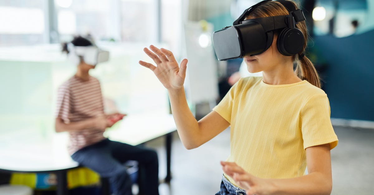 Is it possible to freeze wine for future use? - Young female in VR glasses standing in light room and testing new device Is it possible to freeze wine for future use? - Young female in VR glasses standing in light room and testing new device