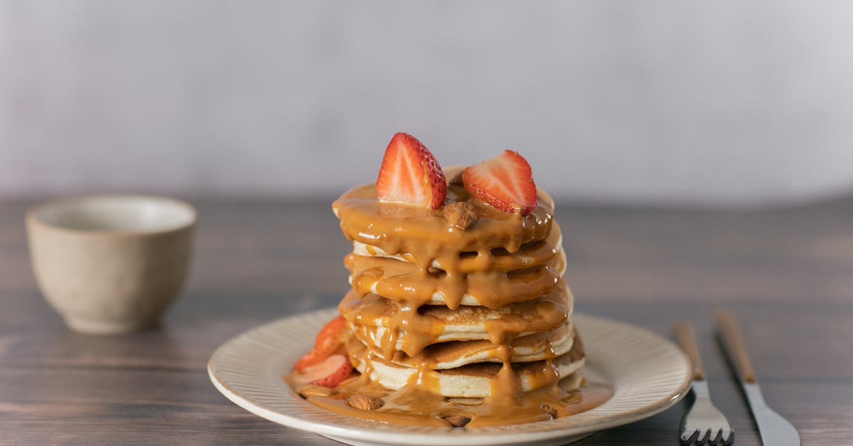 Is it possible to make caramel that does not taste sweet? - Appetizing pancakes topped with ripe strawberries and sweet caramel served on wooden table with cutlery and mug in light kitchen Is it possible to make caramel that does not taste sweet? - Appetizing pancakes topped with ripe strawberries and sweet caramel served on wooden table with cutlery and mug in light kitchen