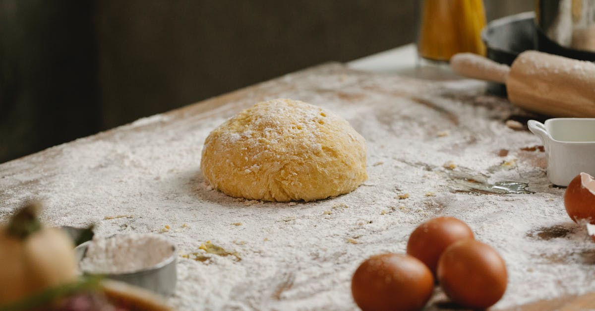 Is It Possible to Make Elbow Pasta At Home? - From above of raw dough placed on table covered with flour near kitchen utensils and eggs in kitchen with ingredients Is It Possible to Make Elbow Pasta At Home? - From above of raw dough placed on table covered with flour near kitchen utensils and eggs in kitchen with ingredients