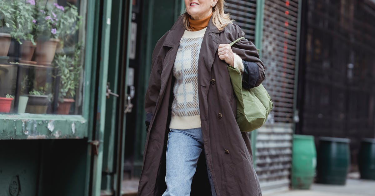 Is it possible to mature shop-bought hard cheese? - Middle aged female in coat and checkered sweater with bag walking on urban pavement while looking forward Is it possible to mature shop-bought hard cheese? - Middle aged female in coat and checkered sweater with bag walking on urban pavement while looking forward