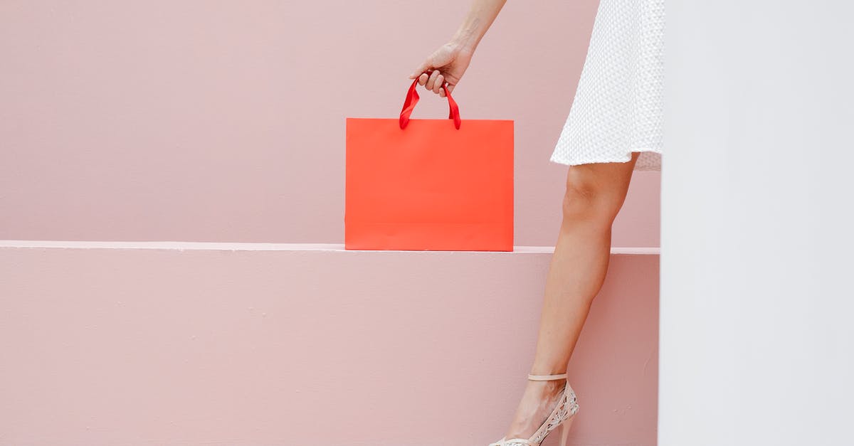 Is it possible to purchase Disodium Ribonucleotides (E635) in consumer/small quantities? - Crop anonymous stylish female in white dress and high heels carrying red shopping bag against pink wall Is it possible to purchase Disodium Ribonucleotides (E635) in consumer/small quantities? - Crop anonymous stylish female in white dress and high heels carrying red shopping bag against pink wall