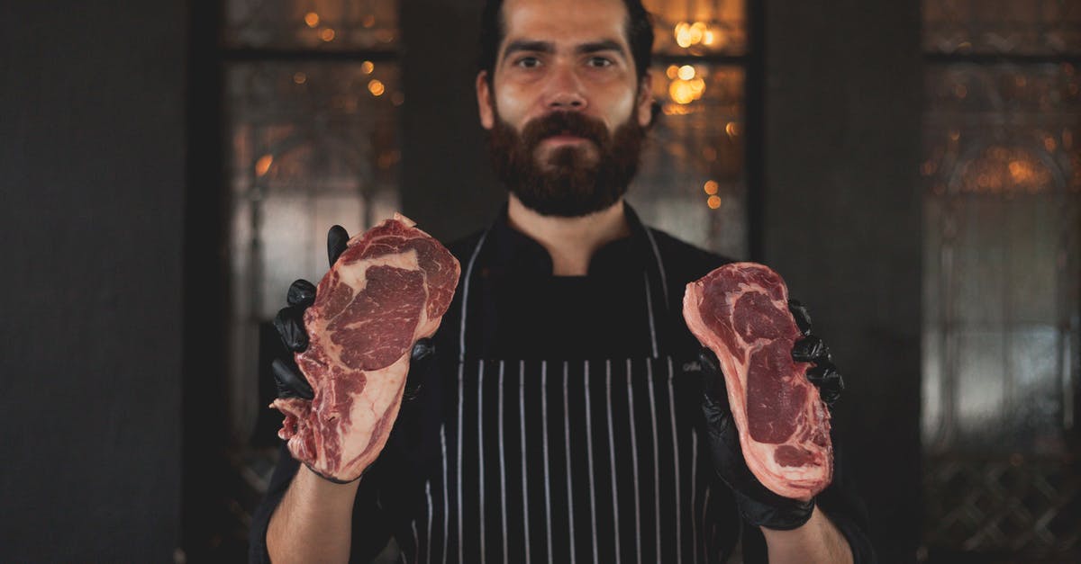 Is it safe to eat a cooked steak that (briefly) touched the plate that was holding the raw meat? - Bearded Man Holding Slices of Raw Meat Is it safe to eat a cooked steak that (briefly) touched the plate that was holding the raw meat? - Bearded Man Holding Slices of Raw Meat