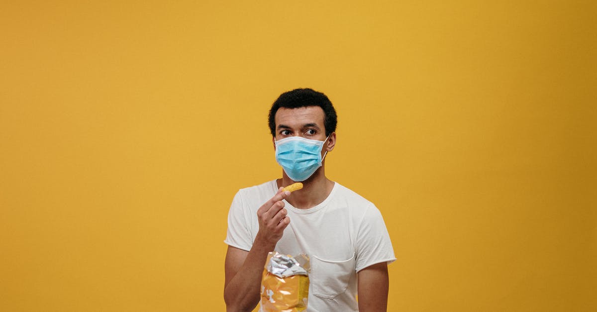 Is it safe to eat mouldy bread? - Man in White Crew Neck T-shirt Eating Chips Is it safe to eat mouldy bread? - Man in White Crew Neck T-shirt Eating Chips