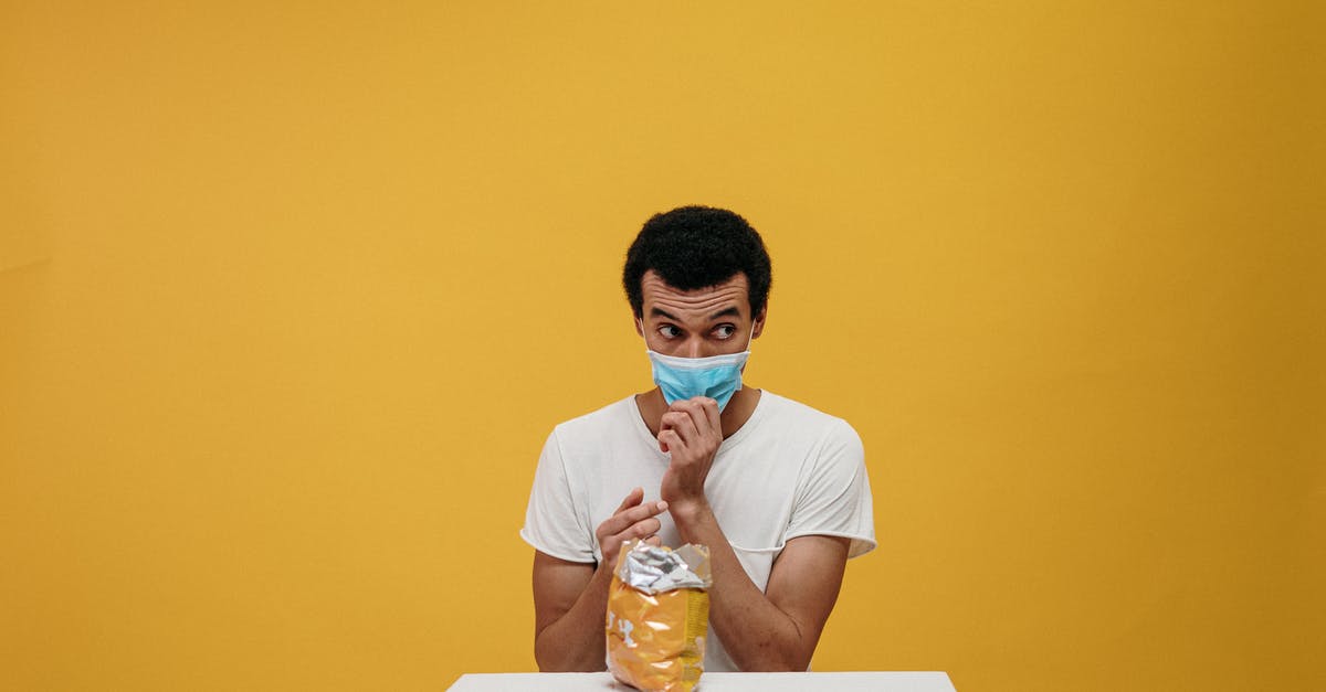 Is it safe to eat mouldy bread? - Man in White Crew Neck T-shirt Eating Chips Is it safe to eat mouldy bread? - Man in White Crew Neck T-shirt Eating Chips