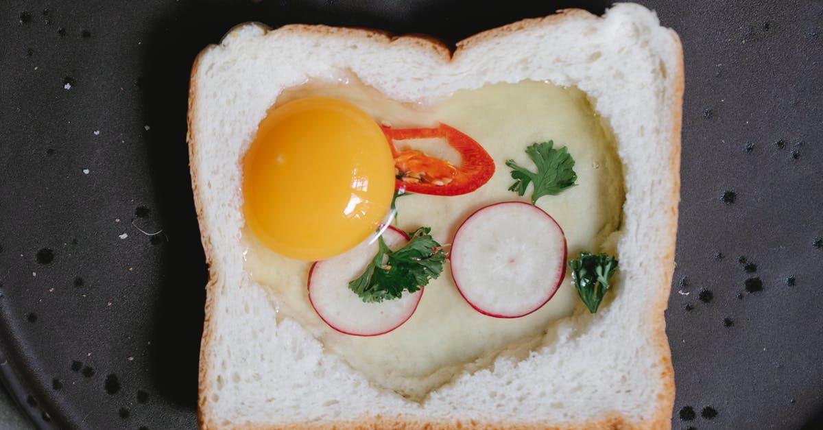 Is it safe to eat raw eggs? - Top view set of organic pastel colored raw chicken eggs placed on wooden table in daylight Is it safe to eat raw eggs? - Top view set of organic pastel colored raw chicken eggs placed on wooden table in daylight