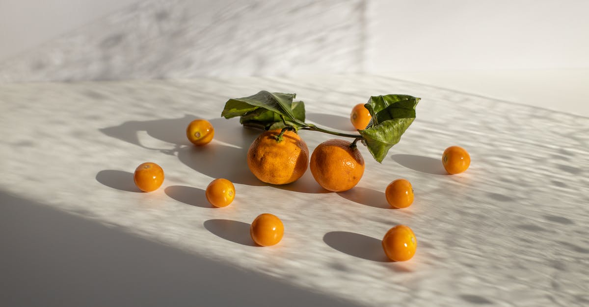 Is it safe to eat raw fish? - Healthy tangerines and groundcherries scattered on white surface in daylight Is it safe to eat raw fish? - Healthy tangerines and groundcherries scattered on white surface in daylight