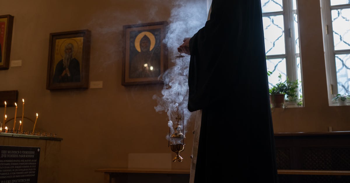 Is it safe to smoke a 20lb turkey? - Woman in Black Robe Standing Near White Flower Bouquet