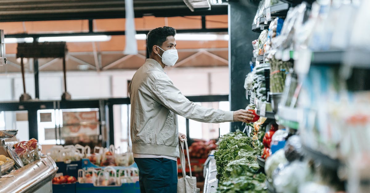 Is it safe to store batter/dough that contains eggs? - Man in mask choosing fresh groceries in store Is it safe to store batter/dough that contains eggs? - Man in mask choosing fresh groceries in store