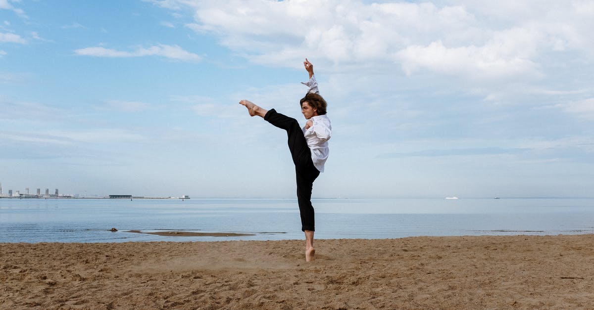 Is it true that natural peanut butter splits in cookies? - Woman in White Long Sleeve Shirt and Black Pants Standing on Brown Sand Near Body of during Is it true that natural peanut butter splits in cookies? - Woman in White Long Sleeve Shirt and Black Pants Standing on Brown Sand Near Body of during