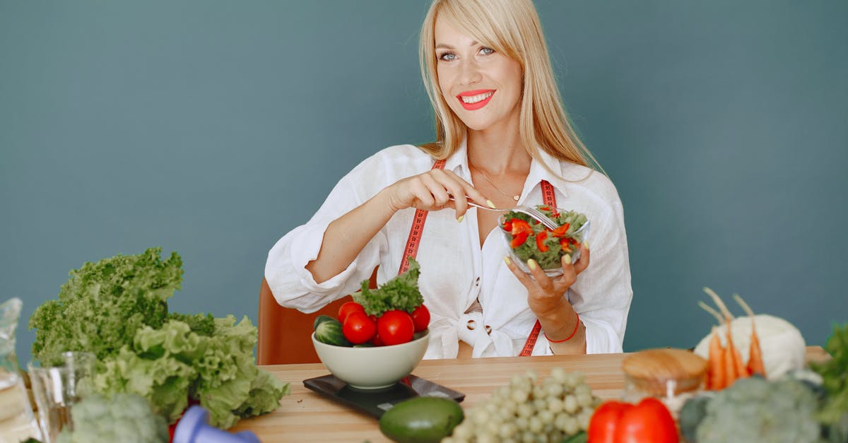 Is it worth tearing lettuce for salad? - Woman in White Dress Shirt Holding Red Cherry Fruit