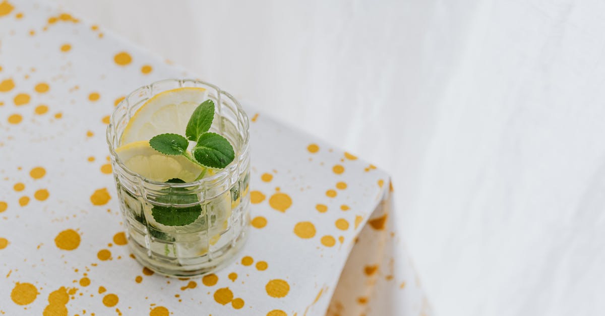 Is lemonade better when made with simple syrup? - Glass of fresh cocktail on corner of table Is lemonade better when made with simple syrup? - Glass of fresh cocktail on corner of table
