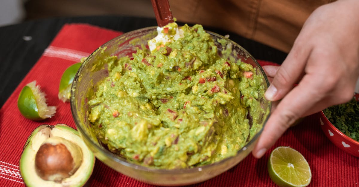 Is making guacamole a way to "save" almost-gone avocadoes? - Person Making Guacamole Is making guacamole a way to "save" almost-gone avocadoes? - Person Making Guacamole