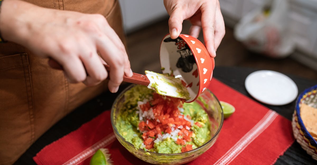 Is making guacamole a way to "save" almost-gone avocadoes? - Person Making Guacamole Is making guacamole a way to "save" almost-gone avocadoes? - Person Making Guacamole