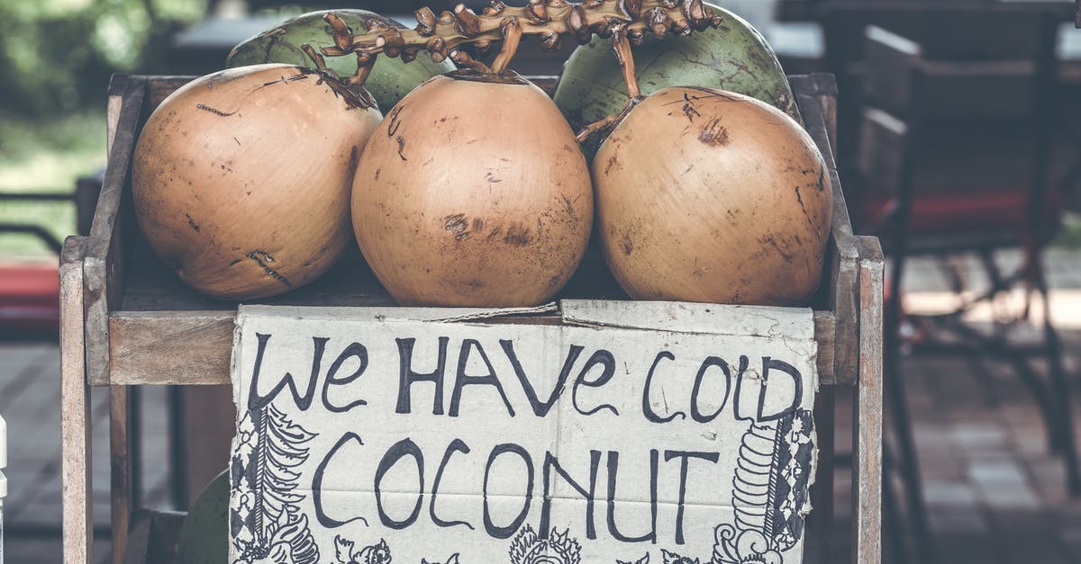 Is raw coconut safe to eat? - Tan Coconuts Placed Atop Brown Wooden Table Is raw coconut safe to eat? - Tan Coconuts Placed Atop Brown Wooden Table