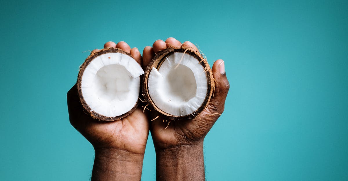 Is raw coconut safe to eat? - Photo Of Person Holding Coconut Is raw coconut safe to eat? - Photo Of Person Holding Coconut