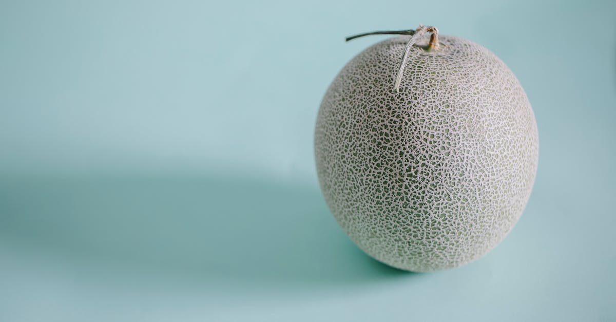 Is raw honey safe to consume? - Japanese melon on blue background Is raw honey safe to consume? - Japanese melon on blue background