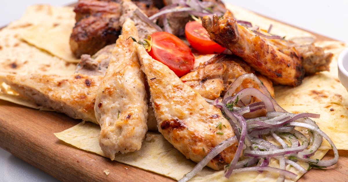 Is reusing bones for stock better than once cooking longer with more water? - Delicious Meat Dish Served on a Wooden Tray