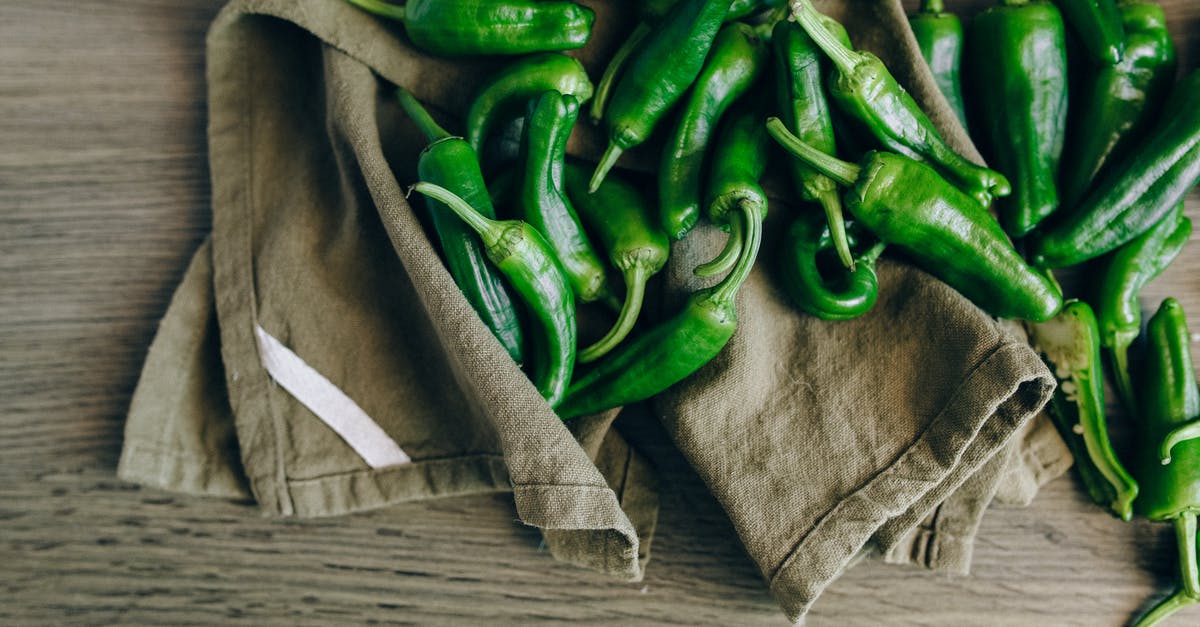 Is Serrano an acceptable substitute for jalapeno - Green Chilies on Wooden Table Is Serrano an acceptable substitute for jalapeno - Green Chilies on Wooden Table