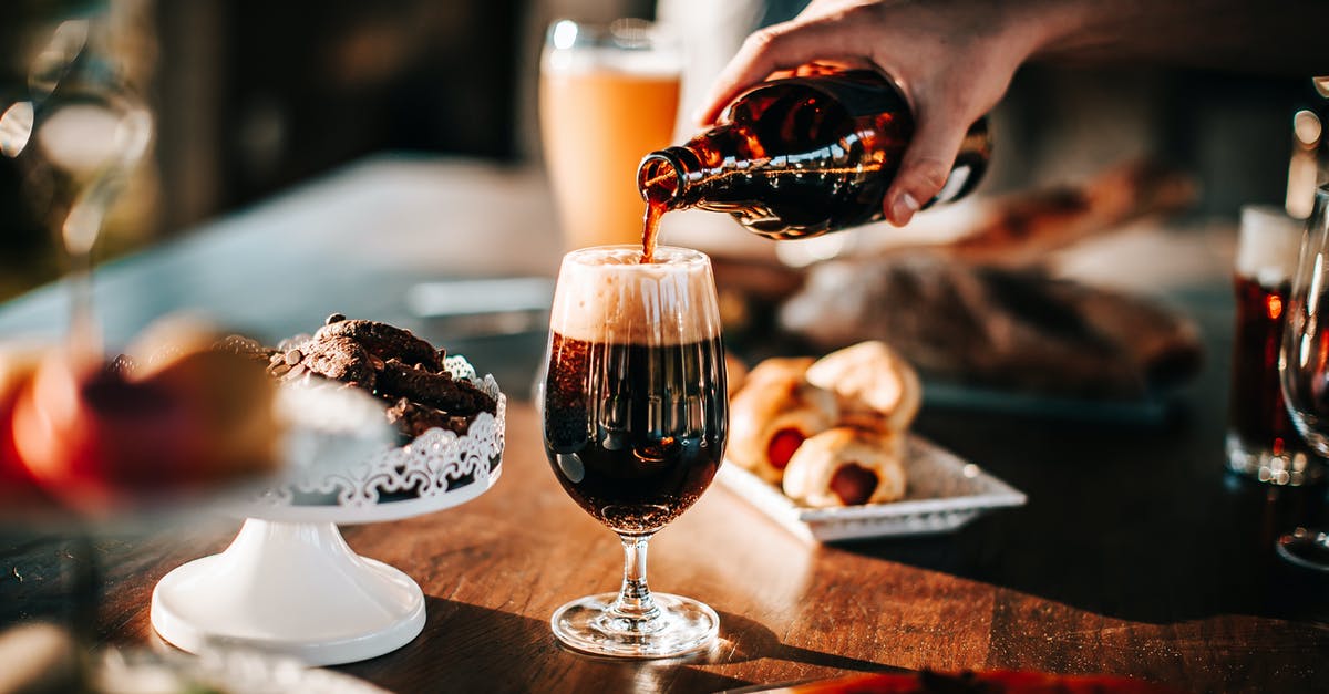 Is the pouring method of beer really important? - Person Pouring Drink On Wine Glass Is the pouring method of beer really important? - Person Pouring Drink On Wine Glass