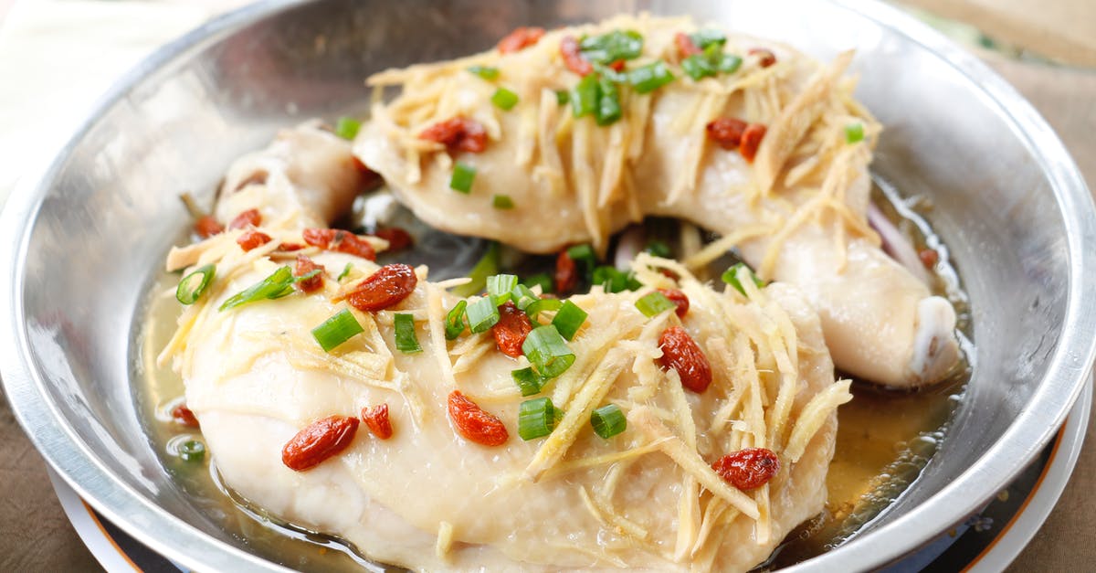 Is there a difference between poached and steamed chicken? - Steamed Chicken on Stainless Bowl Is there a difference between poached and steamed chicken? - Steamed Chicken on Stainless Bowl