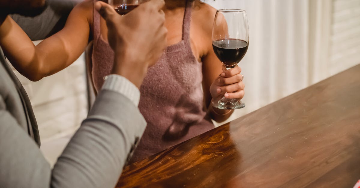 Is there a difference in taste between female and male beef? - African American couple drinking wine at table Is there a difference in taste between female and male beef? - African American couple drinking wine at table