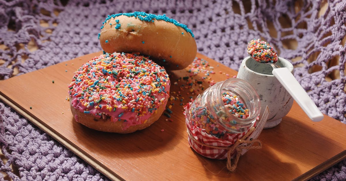 Is there a frosting similar to whipped cream but without cream? - Sweet doughnuts garnished with multicolored toppings placed on wooden board with jar of sweet sprinkles Is there a frosting similar to whipped cream but without cream? - Sweet doughnuts garnished with multicolored toppings placed on wooden board with jar of sweet sprinkles