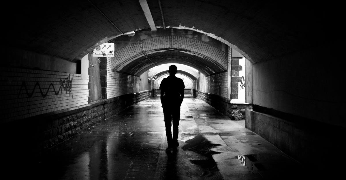 Is there a good, clean way to pit black olives? - Silhouette Photo of a Man in a Tunnel Is there a good, clean way to pit black olives? - Silhouette Photo of a Man in a Tunnel