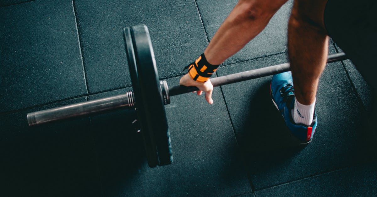 Is there a hand blender with a metal coupling connection? - Person Wearing Black Shorts and Blue Lace-up Low-top Sneaker Holding Black Barbell Is there a hand blender with a metal coupling connection? - Person Wearing Black Shorts and Blue Lace-up Low-top Sneaker Holding Black Barbell