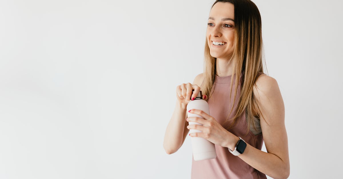 Is there a maximum amount of time heavy cream can be fermented? - Happy young woman opening cosmetic bottle while standing against white background Is there a maximum amount of time heavy cream can be fermented? - Happy young woman opening cosmetic bottle while standing against white background